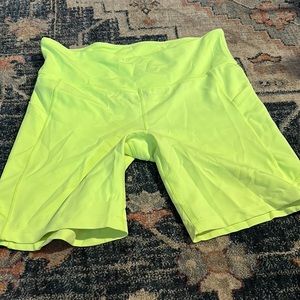 Neon green biker shorts with pockets